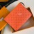 pochette voyage orange +$88.00